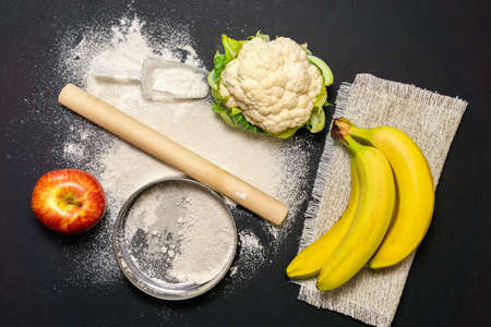 flour from vegetables and fruits on a dark background. the view from the top. flat lay. low carb diet, gluten free, planted based vegan foodの写真素材