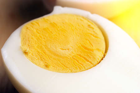 one egg and half of boiled egg close-up. Protein, keto diet, diet food