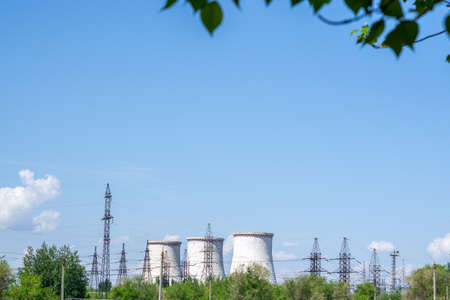 Big power plant with pipes, bright Sunny day blue sky, place for text