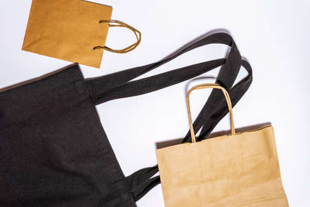paper shopping bags on white background. Eco-friendly packaging. Shopping. ECO-friendly, reusable...