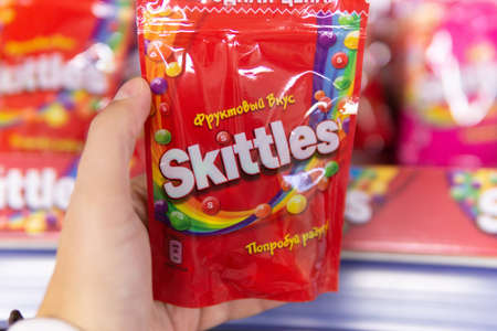 Tyumen, Russia-October 11, 2020: Skittles multicolored fruit candies are sold in the hypermarket...