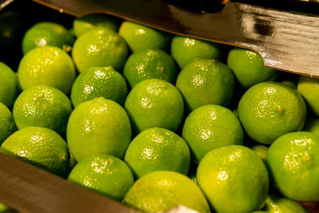 Many limes close up, citrus fruit background.Buy ripe nature products.の写真素材