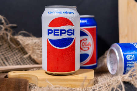 Tyumen, Russia-November 01, 2020: Cans of Pepsi in a retro rustic style. owned by the American...
