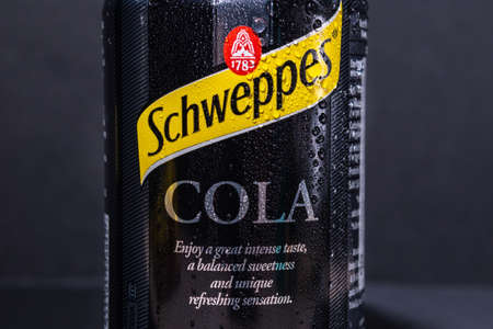 Tyumen, Russia-November 02, 2020: Can of the Schweppes cola with water drops. Popular Schweppes products ginger ale, introduced in 1870のeditorial素材