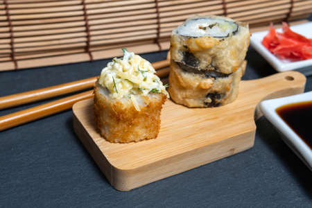 Japanese cuisine sushi rolls. close-up, selective focus. takes chopsticksの写真素材