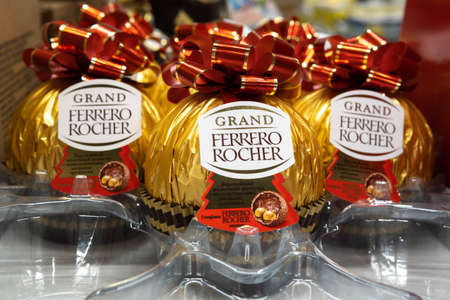Tyumen, Russia-November 07, 2020: Ferrero Rocher is a spherical chocolate produced by the Italian chocolatier Ferrero SpA, Shopping concept.のeditorial素材