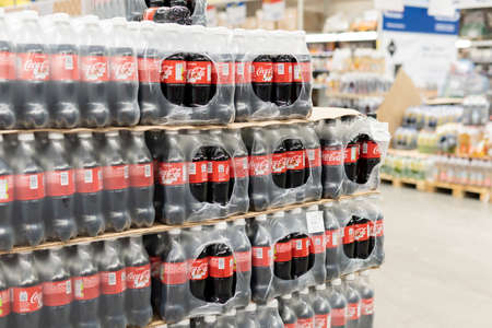 Tyumen, Russia-November 07, 2020: Plastic bottles of Coca Cola on display on Coca Cola standのeditorial素材