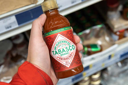 Tyumen, Russia-November 07, 2020: Tabasco brand sauce sriracha bottle of The Original Red sauce, the products in the hypermarketのeditorial素材