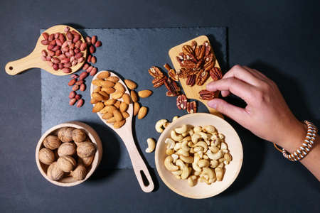 Walnuts, cashew, almond, pecan, hazelnut, peanuts Healthy super food Mix of nuts top viewの写真素材