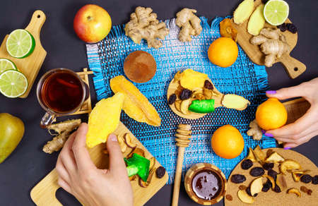 Dried fruits chips. Dietary nutrition. Natural and healthy snack food. Diet chips from dried fruits apples, mango, prunes, ginger, limeの写真素材