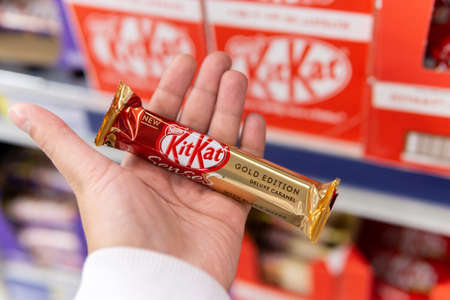 Tyumen, Russia-October 11, 2020: Nestle Kit Kat candy bar selective focus. in the hand of a...