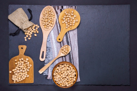 Raw chickpeas in bowl on a dark background. A view from above, a copyspace.の写真素材