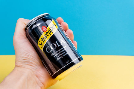 Tyumen, Russia-December 10, 2020: Can of the Schweppes cola logo close up.