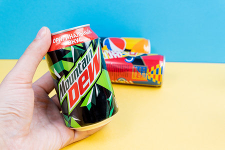 Tyumen, Russia-December 10, 2020: Mountain Dew PepsiCo can logo. selective focus