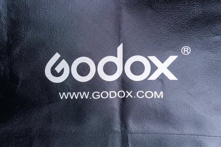 Tyumen, Russia-December 10, 2020: Godox label close-up logo. Softbox for photo and video shootingのeditorial素材