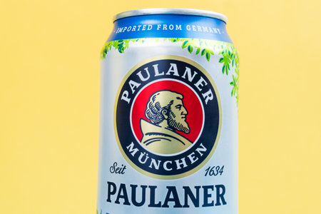 Tyumen, Russia-December 10, 2020: Paulaner Hefe Weizen beer from Munich, logo on aluminum can close-up with drops. selective focusのeditorial素材