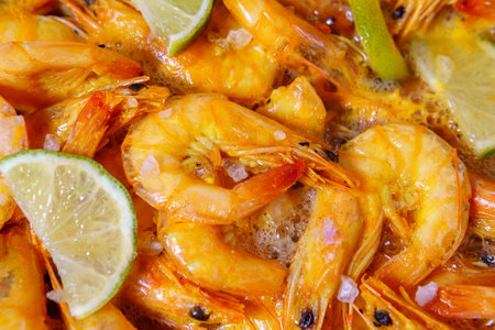 big raw tiger prawns roasted with lemon. close up selective focusの写真素材
