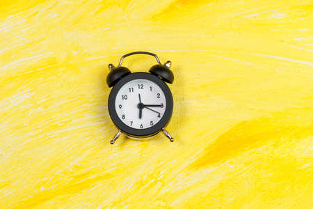 alarm clock top view. The concept of time, delay, morning rise, the appointed meeting. copy space. flat lay.の写真素材