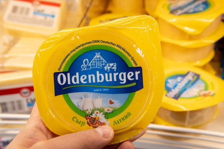 Tyumen, Russia-January 31, 2021: oldenburger cheese. Oldenburger is a trademark of DMK Group, the largest dairy cooperative in Germanyのeditorial素材