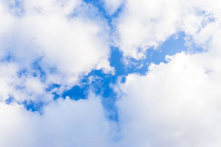 Air clouds in the blue sky. Blue backdrop in the air. Abstract style for text.