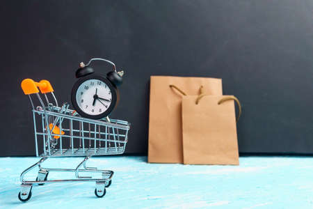 clock on the shopping cart, lack of time, waste of time, purchasing time.
