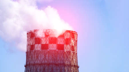 Smoke from industrial pipes close up. against the blue sky.