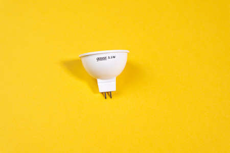 Tyumen, Russia-March 15, 2021: led ceiling light gauss led. on a yellow background gu5. 3 elementaryのeditorial素材