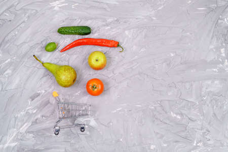 buying healthy vegetables and fruits concept on gray background top view. copyspaceの写真素材