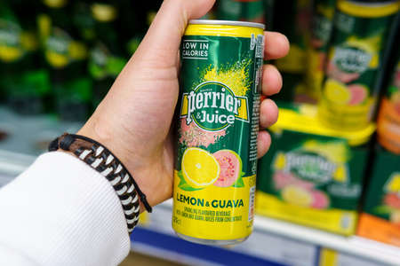 Tyumen, Russia-April 17, 2021: Perrier juice carbonated drinks. Aluminum can. selective focusのeditorial素材