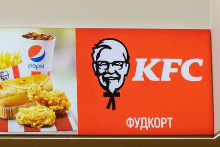 Tyumen, Russia-April 21, 2021: KFC logo fast food restaurant chain specializing in chicken dishes
