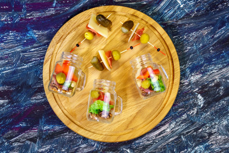 glass jars meat, cheese, olives, gherkins nuts Light snackの写真素材