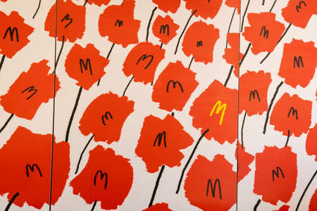 Tyumen, Russia-May 16, 2021: McDonalds logo on the wall in the cafe. Background fast food restaurant