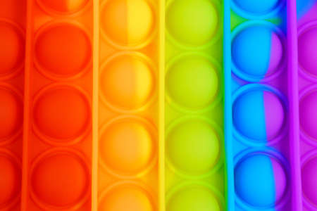 Pop it fidget. Colorful toy push pop it. Close up. Selective focusの写真素材