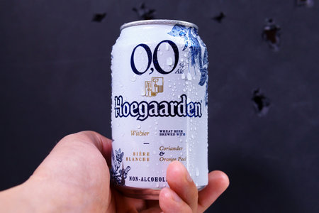 Tyumen, Russia-May 25, 2021: Hoegaarden Beer on dark background. Hoegaarden is a Belgian wheat beer produced by InBevのeditorial素材
