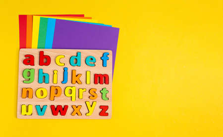 Learning letters, website, video blog. Yellow background Copy spaceの写真素材
