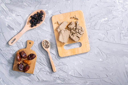 Sunflower halva dates raisins dried fruits. Traditional oriental dessert.