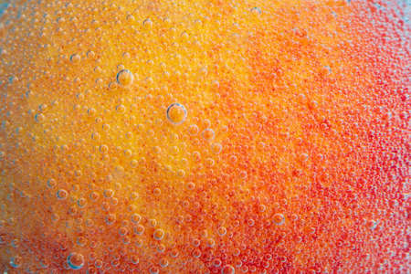 Peach under water close-up macro, selective focus. Concept fruit dietの写真素材