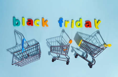 The inscription black Friday on a blue background top view. Concept of sale discountsの写真素材