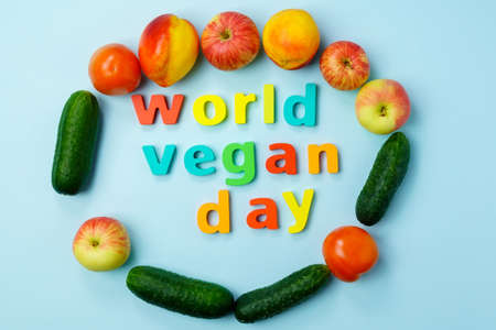 World Vegan Day is celebrated on November 1. Vegetables cucumbers tomatoes, apples.