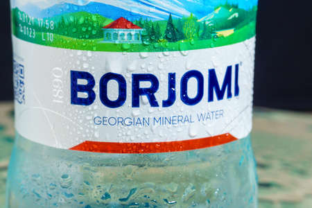 Tyumen, Russia-May 25, 2021: Borjomi mineral water in a can from Georgia. Close up logo