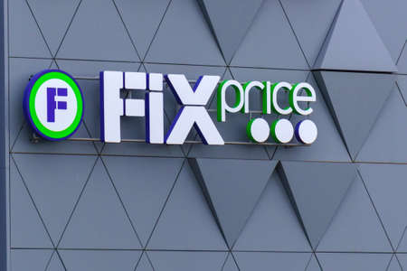 Tyumen, Russia-August 09, 2021: Fix Price logo on the facade of building. Discount low price variety...