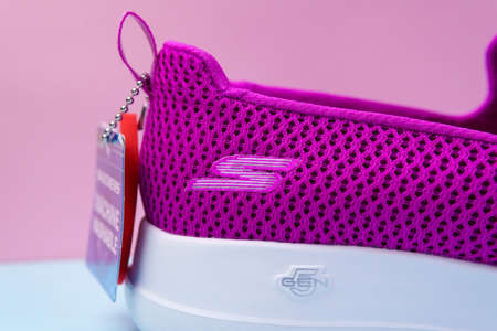 Tyumen, Russia-August 27, 2021: Slip-on shoes for women Skechers Go Walk Joy purple. Skechers USA, Inc. is an American lifestyleのeditorial素材