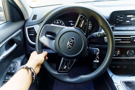 Tyumen, Russia-September 04, 2021: Logo Kia Motors. Brand Sign of Kia Car on the Steering Wheel.