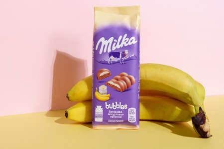 Tyumen, Russia-August 7, 2021: Milka alpine milk chocolate bar with banana, marketed by Mondelez International.のeditorial素材