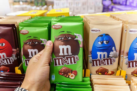 Volzhsky, Russia-September 21, 2021: Milk chocolate m and ms made by Mars Inc. Selective focusのeditorial素材