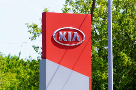 Tyumen, Russia-June 4, 2021: KIA logo close up Motors is a South Korean automotive company producing passenger cars, vans and buses belonging to Hyundai Motor.のeditorial素材