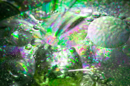 Oil bubbles close-up. Abstract selective background. Drops on a transparent gel surface.