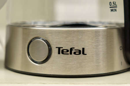 Tyumen, Russia-December 02, 2021: Tefal company logo close-up on the electric kettle