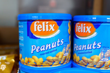 Tyumen, Russia-December 02, 2021: Can of Felix Salted Peanuts. Buying in a hypermarket. Selective focusのeditorial素材