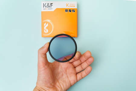 Tyumen, Russia-December 08, 2021: Polarized filter K and F Concept, close-up. Copy space
